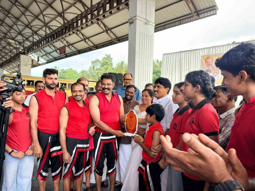 Kerala Agriculture Minister T. Siddique presenting a memento to K.F. Thomas Gurukkal, Managing Director of Kadathanadan Kalari Foundation, during the Wayanad Vimukthi Mission anti-drug awareness program